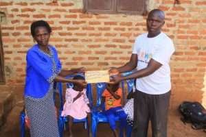 Support Sofiat and her children in Uganda - a mother with children in Katwe village.