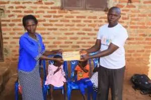 Support Sofiat and her children in Uganda - a mother with children in Katwe village.