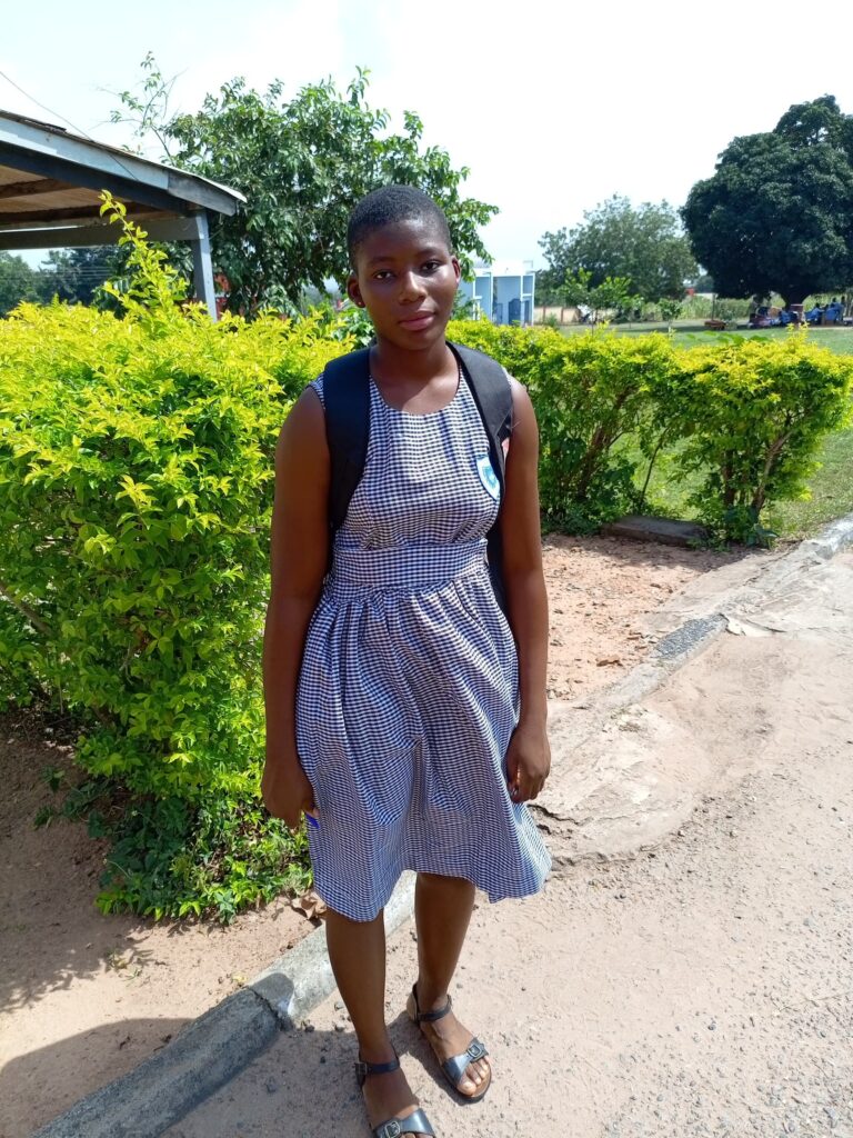 Gloria in school uniform at Kpasec