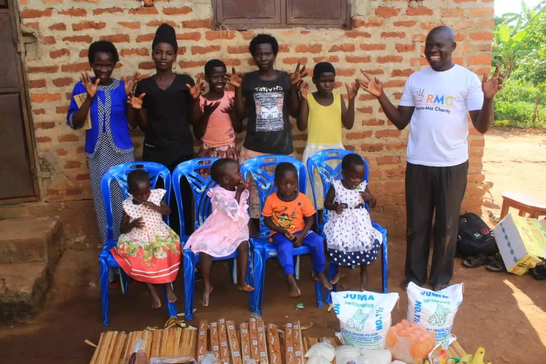 A family receiving food and essential supplies through community support