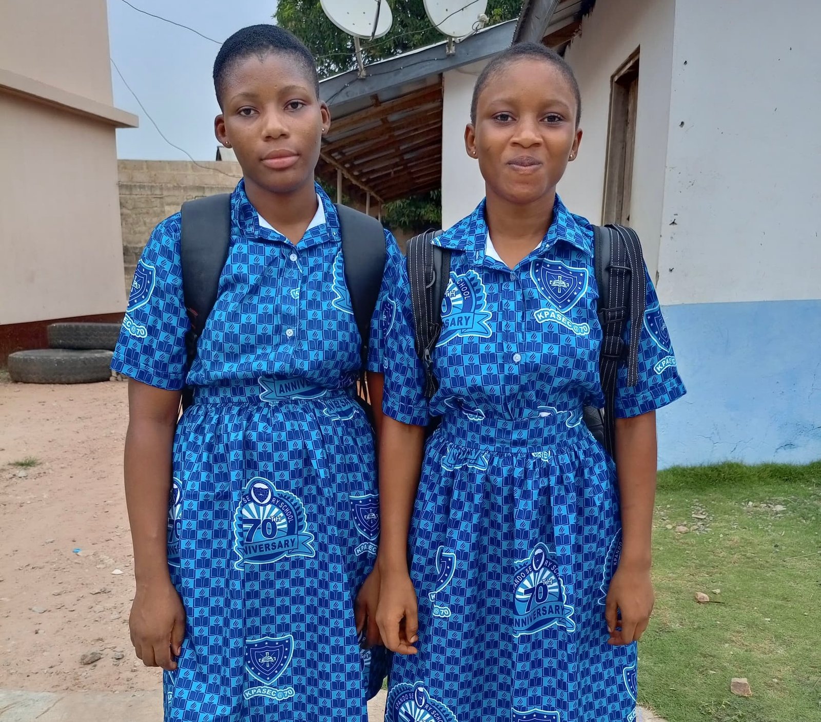 Two students supported through education and school assistance programs