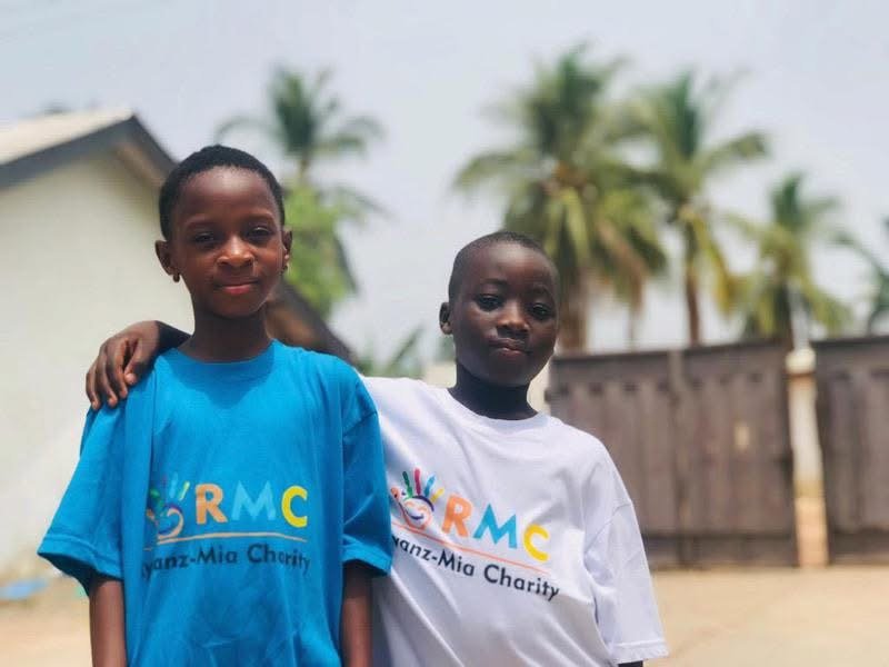 Two children wearing Ryvanz-Mia Charity shirts