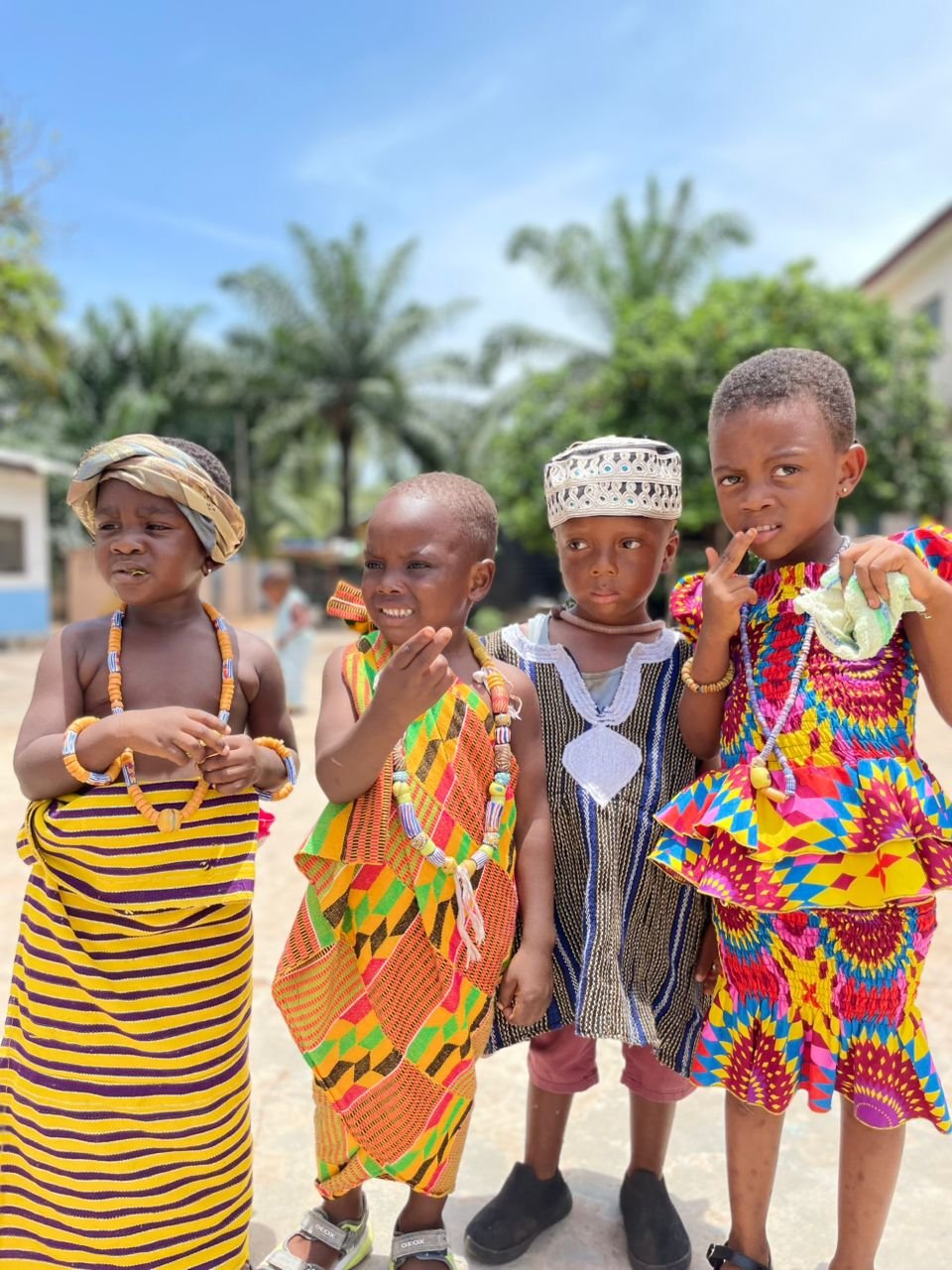 Children standing together in colorful traditional clothing