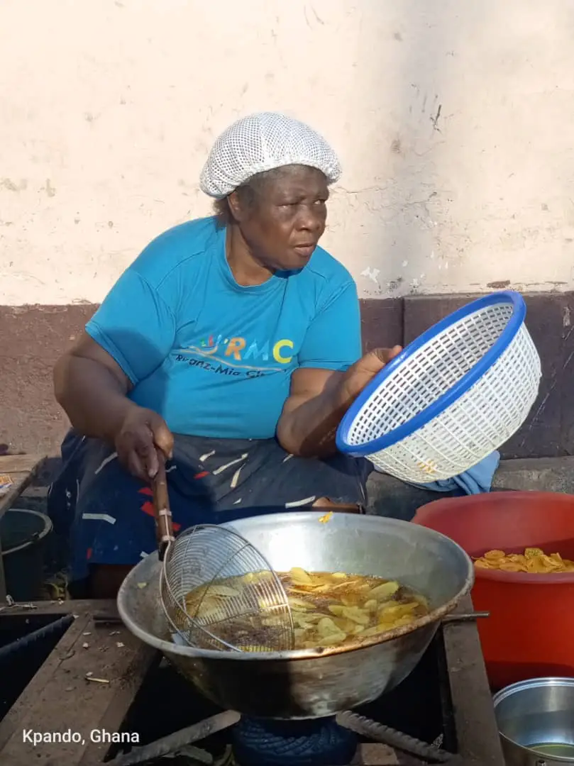 Community members participating in food preparation and livelihood work