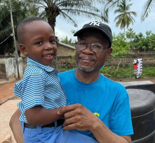 Founder with a child from Hope Memorial School,Kpando Ghana