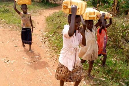 Children from Kaliro Uganda carrying water