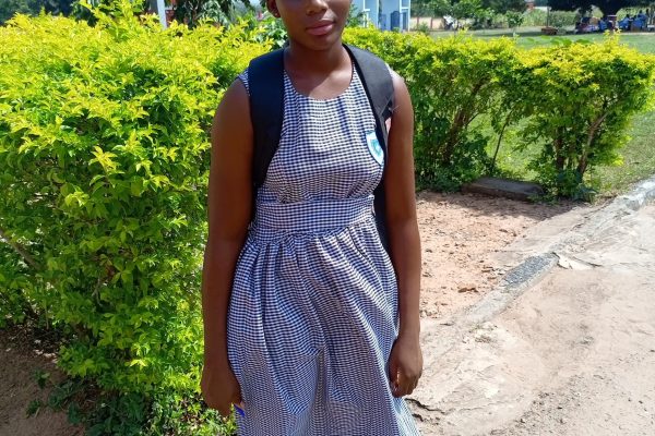 Gloria in school uniform at Kpasec