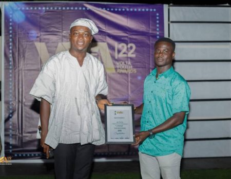 Isaac receiving Volta youth award as best DJ