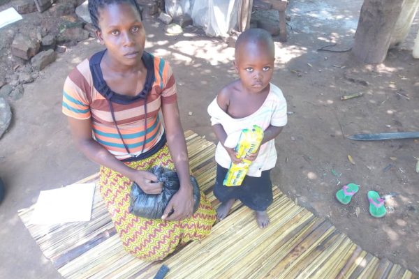 Vulnerable children receiving foodstuffs in Kaliro